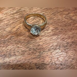Elegant Gold-Toned Ring with Clear Gemstone